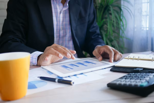 Professional reviewing a retirement plan on a tablet