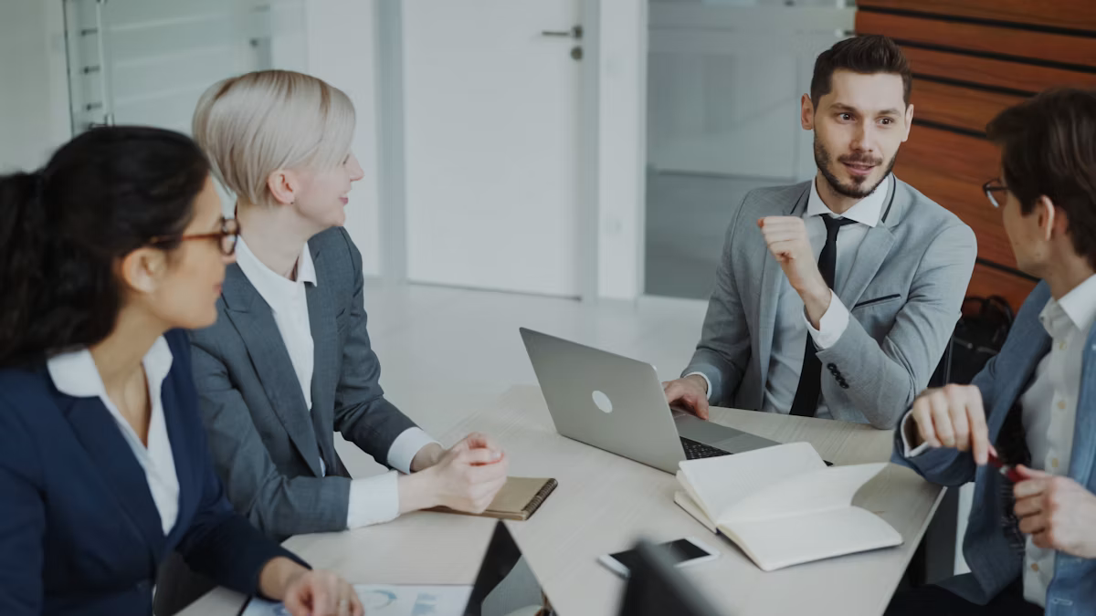 Team of financial professionals reviewing charts together during a meeting